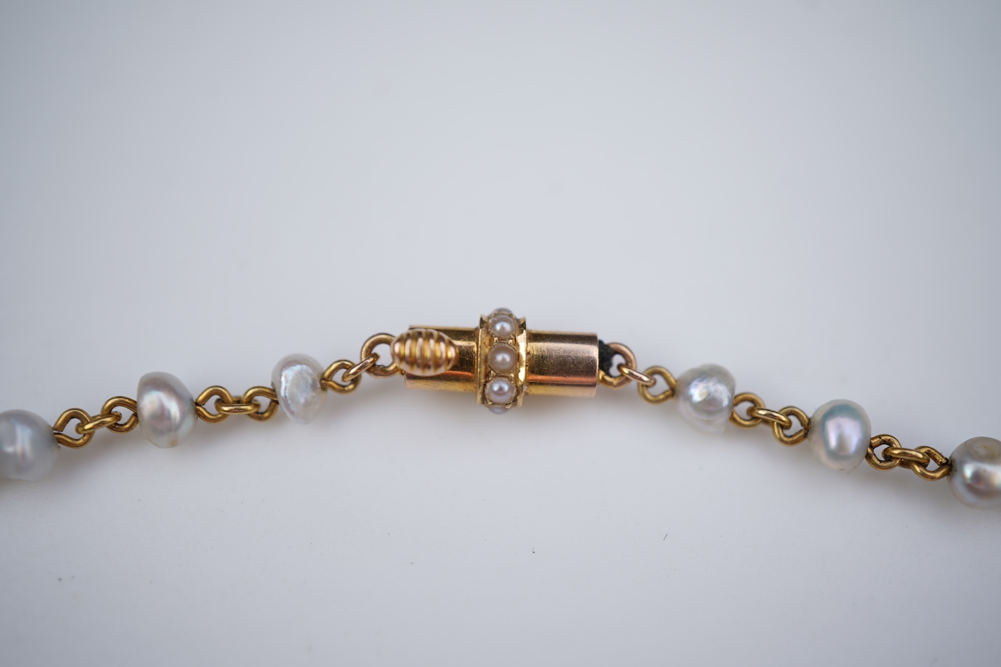 An Edwardian emerald and pearl necklace, early 20th century